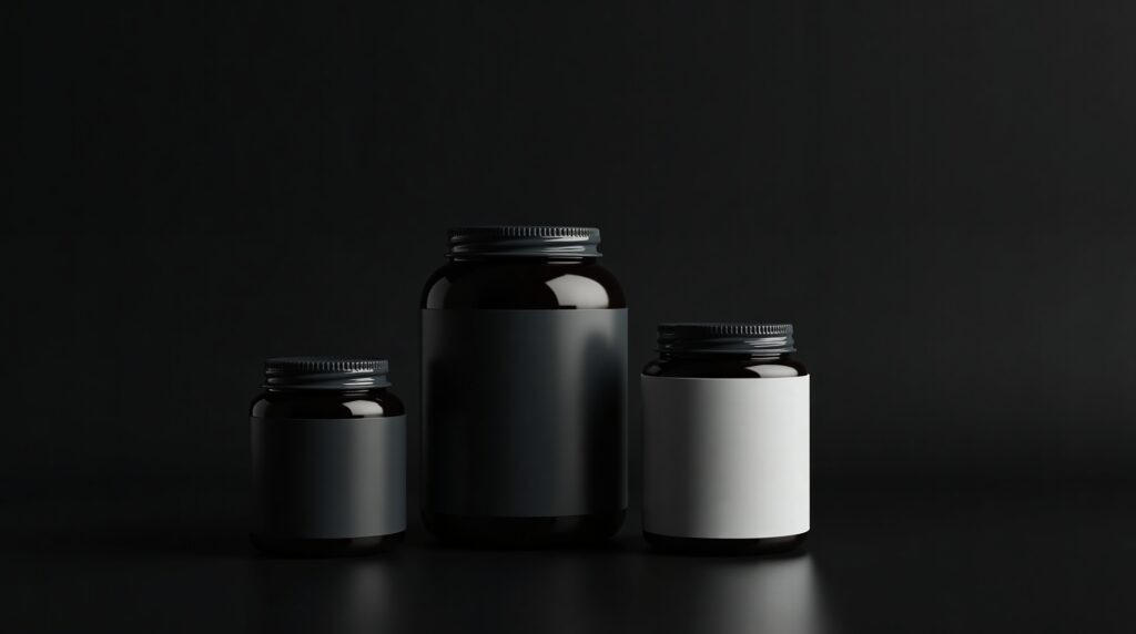 Three standard supplement jars of different sizes on a dark surface, representing different supplement delivery formats.